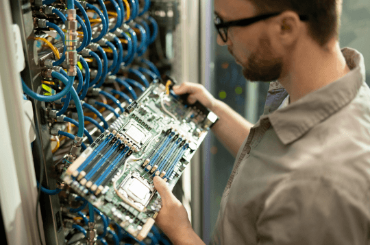 Guy working on a server hardware connection